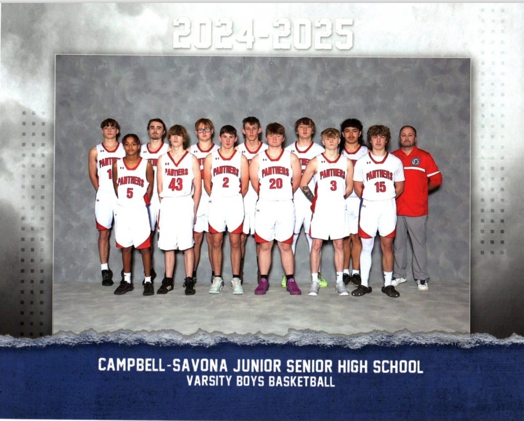CS basketball team posing in uniforms for formal pictures.