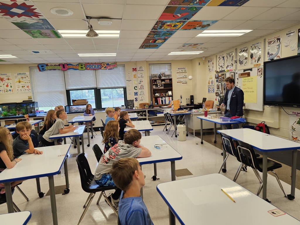 Dr. Vogt showing students how a superconductor works.