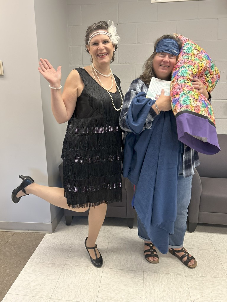 Two teachers dressed as flappers for spirit week