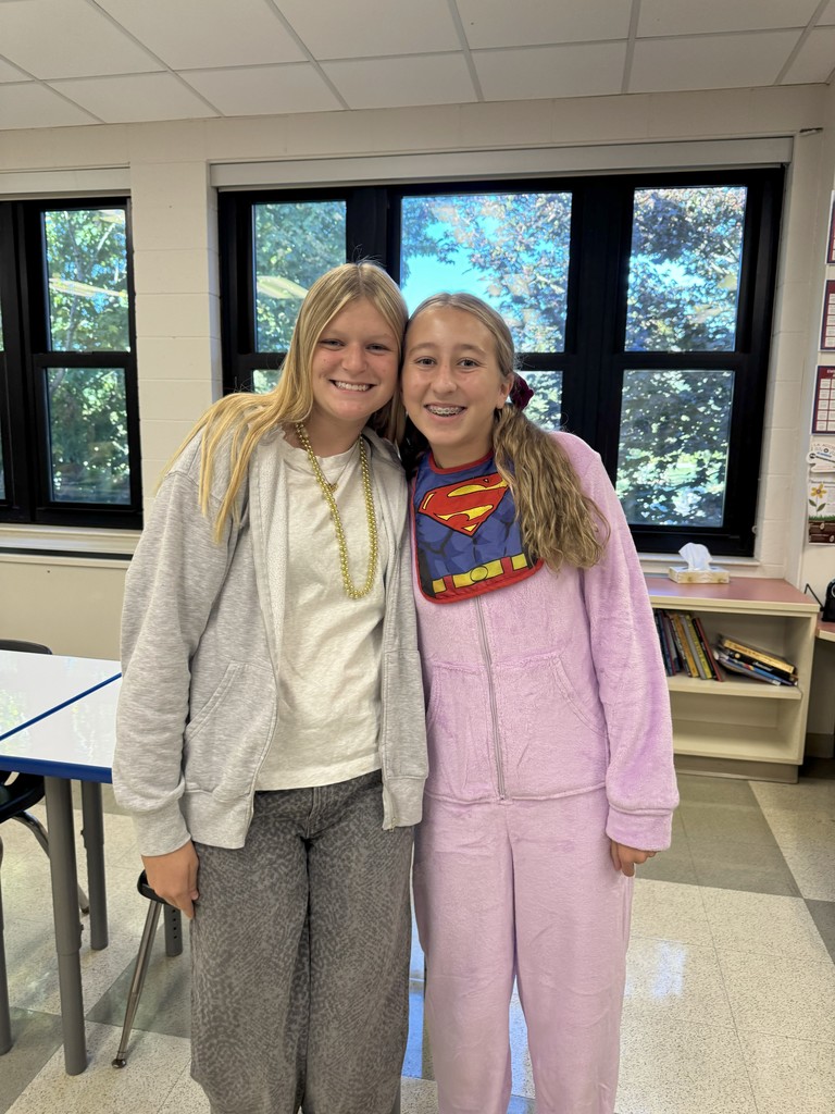 Two students dressed in comfy cozy clothes