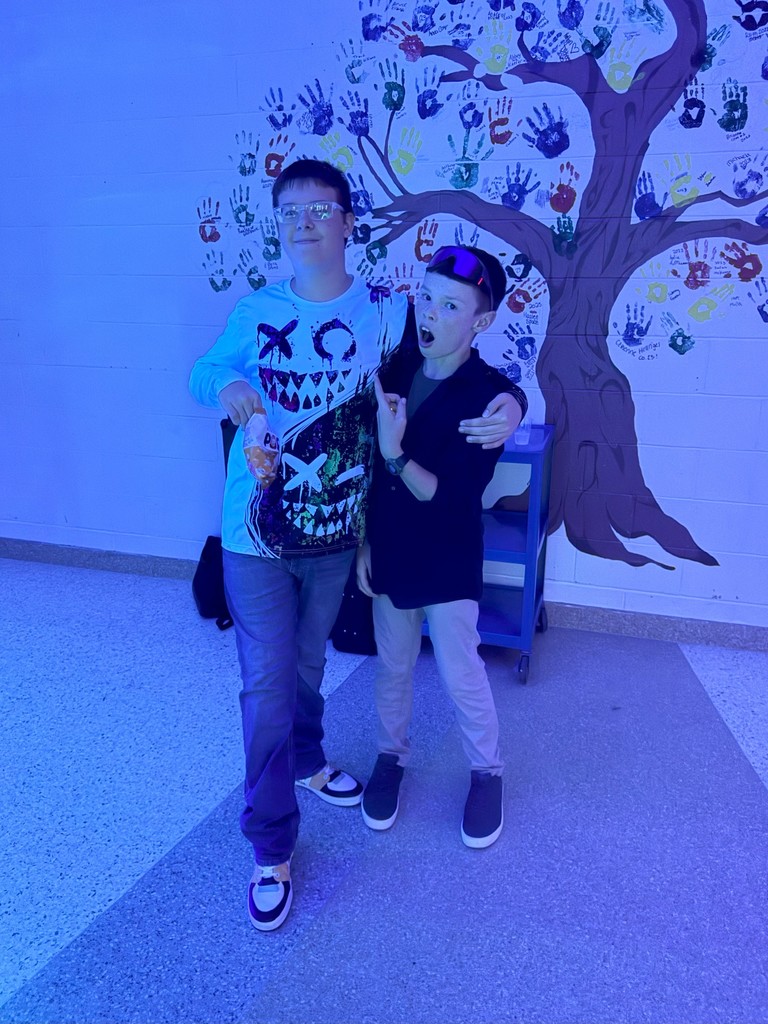 Two students posing at homecoming dance