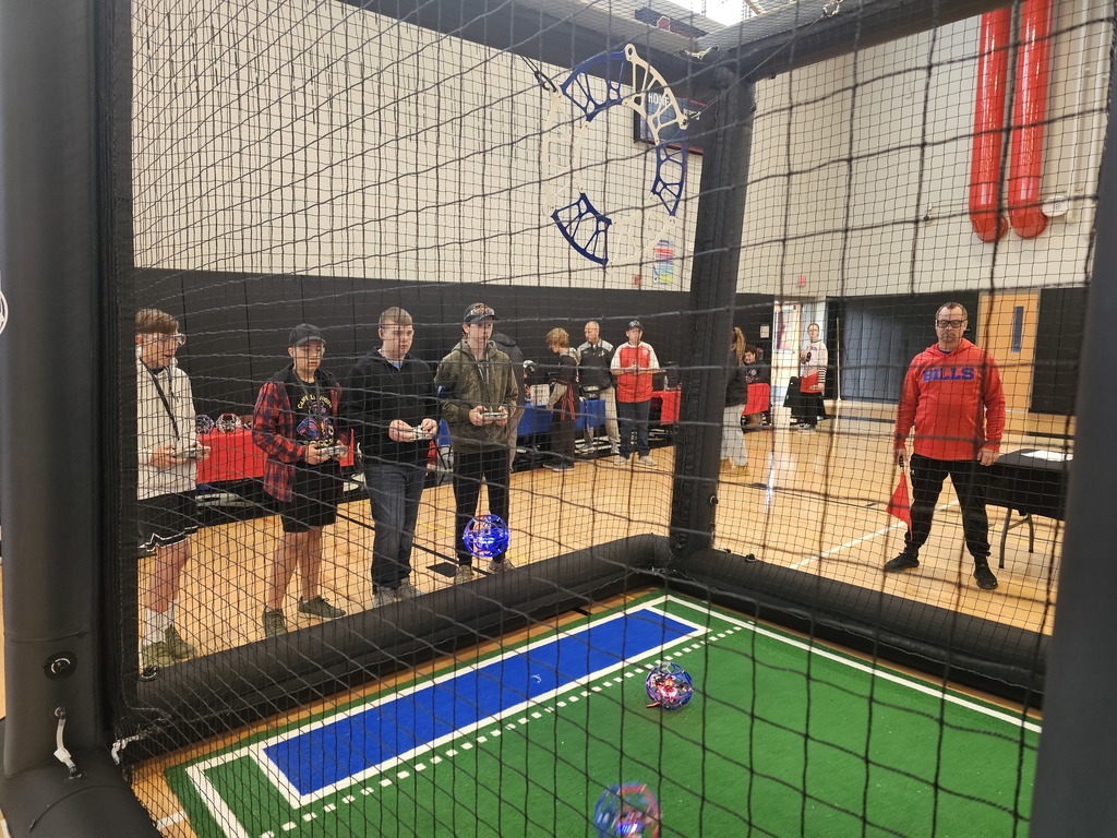 Kids competing with drone soccer arena