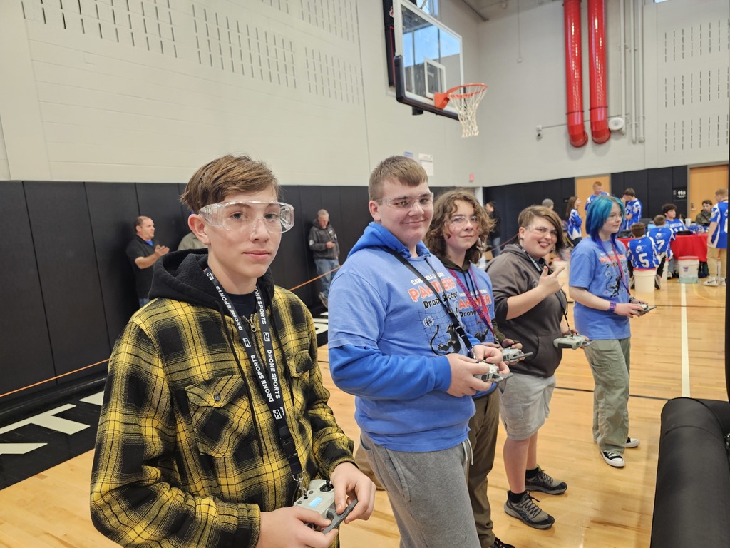 Drone soccer team lined up ready to compete with controllers in hand