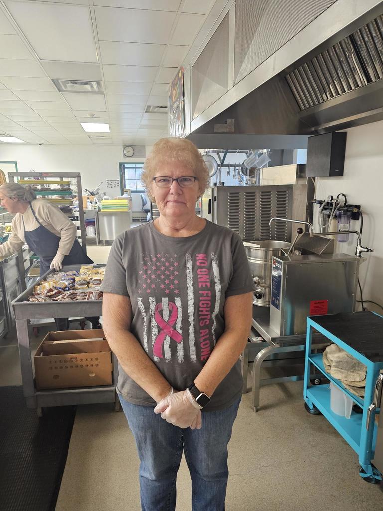 Caferia worker posing for picture