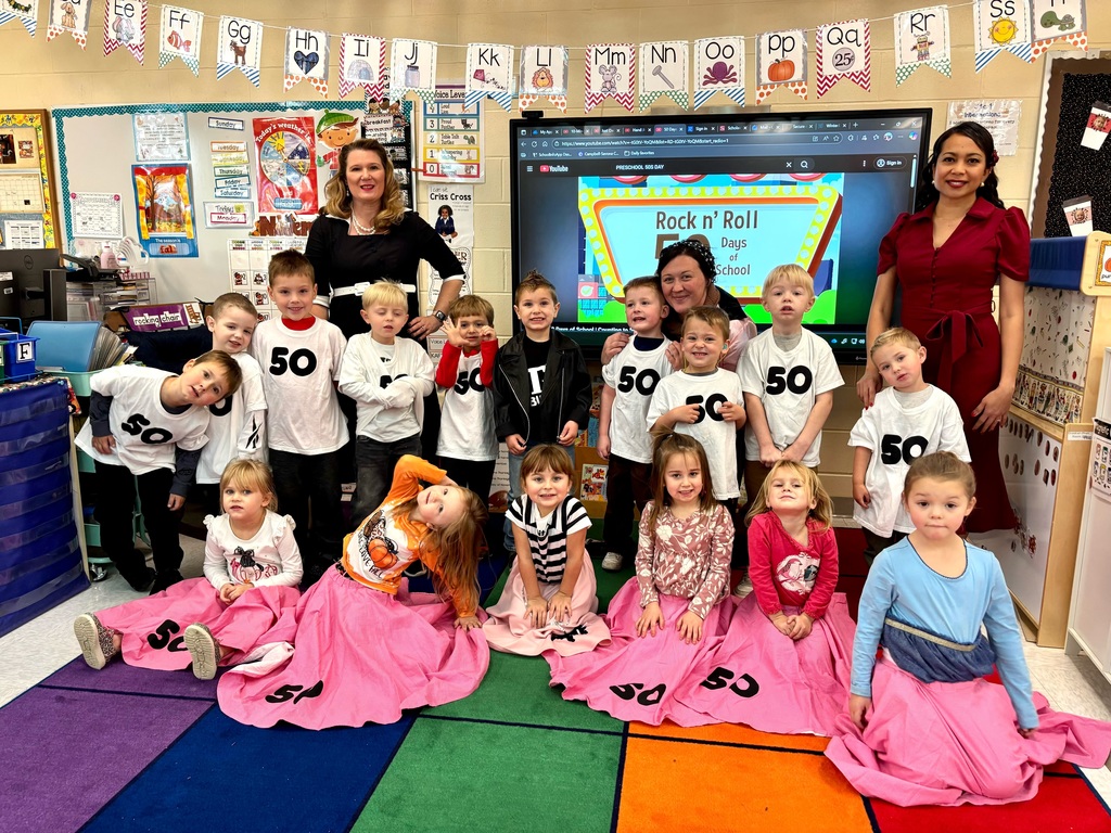 PreK Class posing for picture wearing 50 celebration shirts