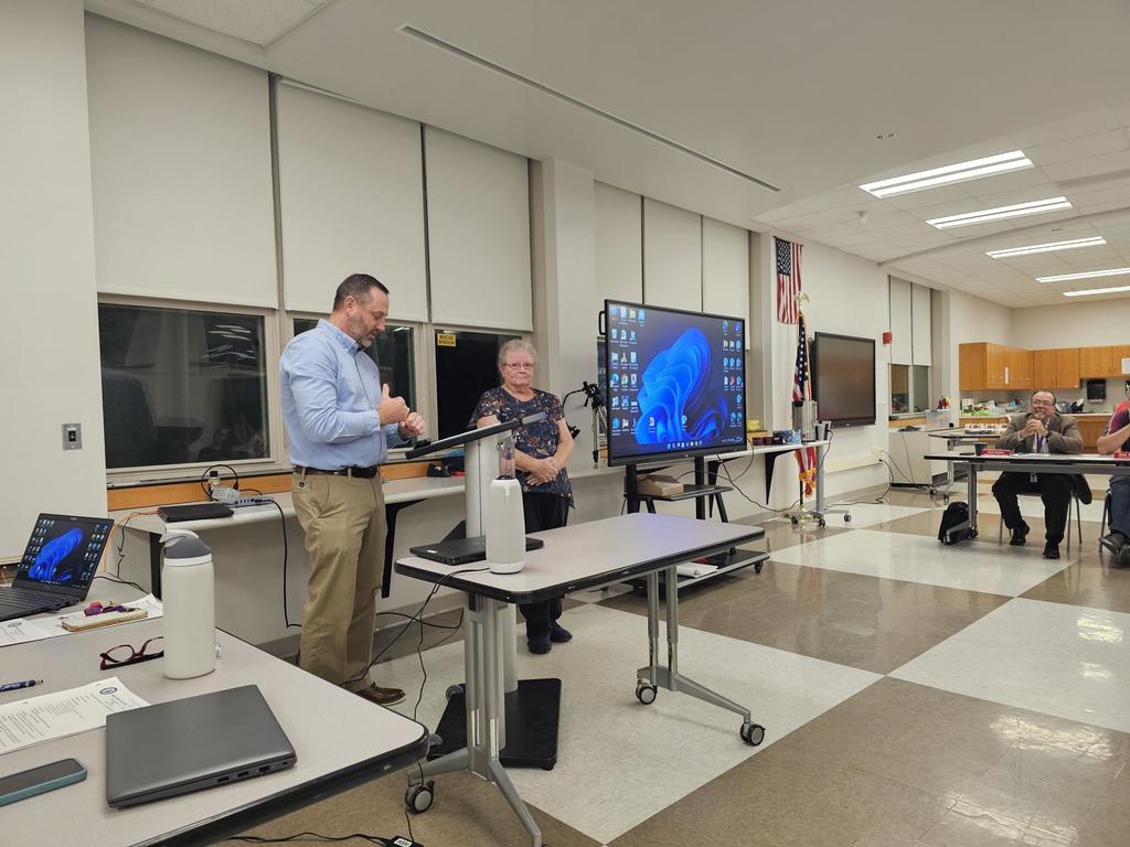 Supt standing next to community member being honored with Panther pride award