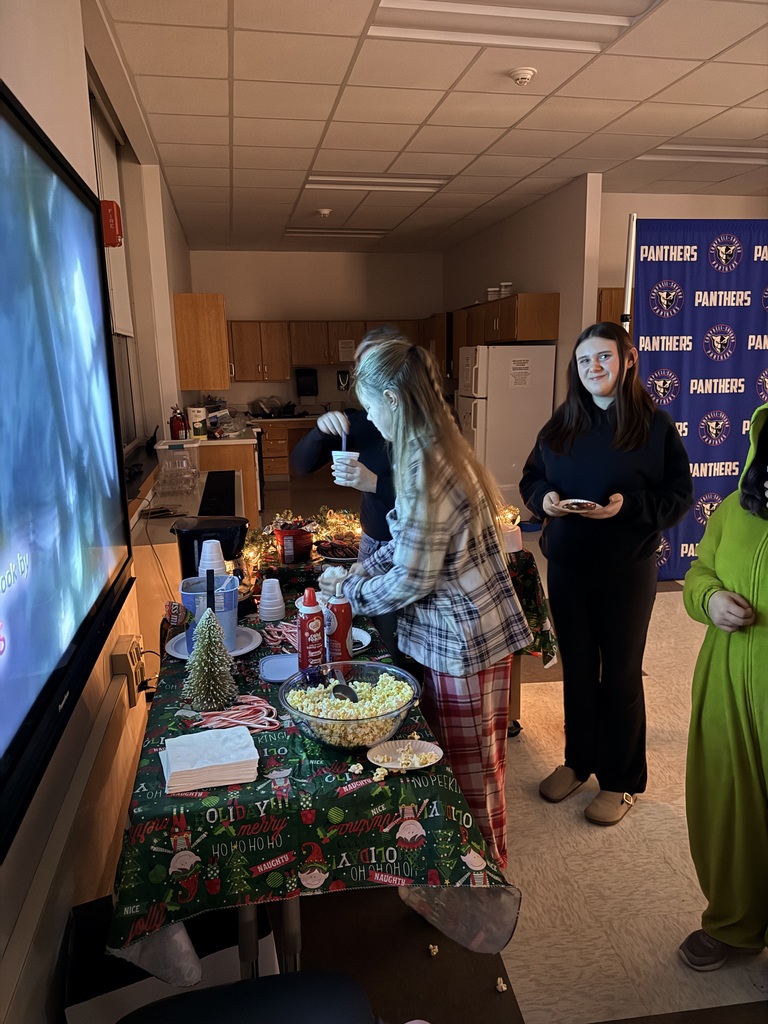 Students getting hot chocolat and popcorn at movie night