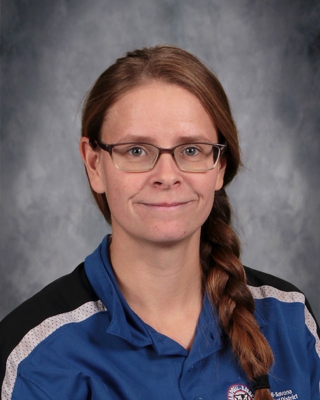 Headshot picture of K Lewis wearing a blue collared CS Work Shirt