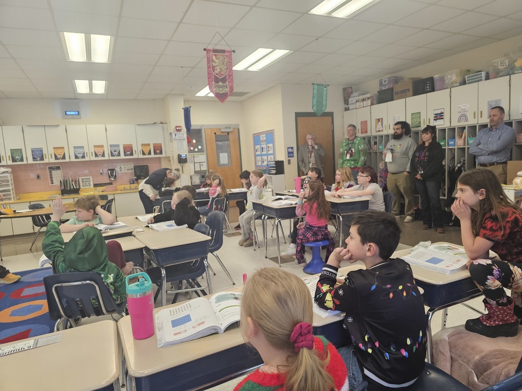 Classroom lesson with students and board of education