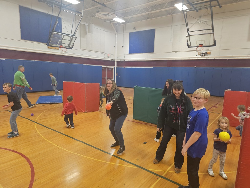 BOE members playing in pe class with students.