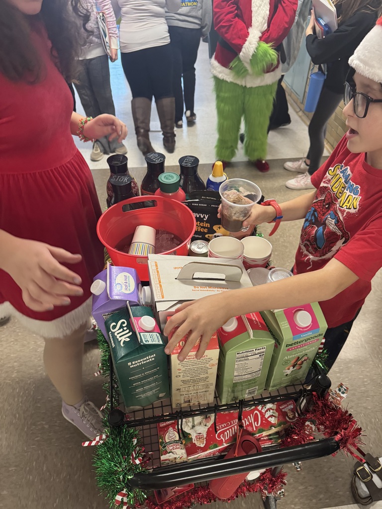 Student handing out coffee and hot chocolate to teachers