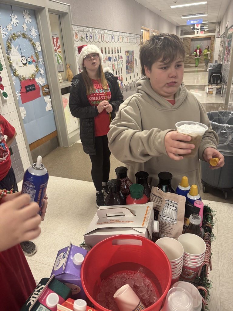 Students handing out hot chocolate to teachers