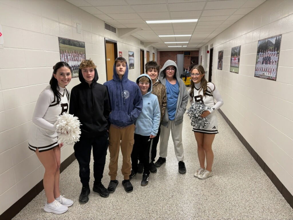 Group photo of basketball students with St. Bonaventure cheeleaders