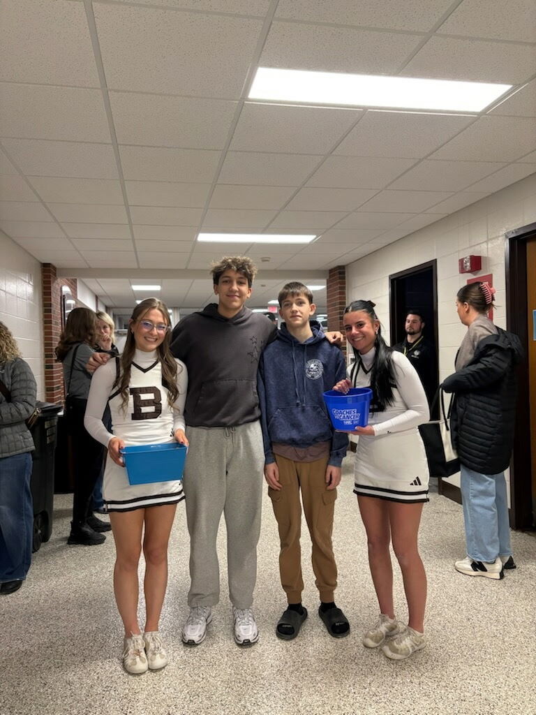 photo of two basketball students with St. Bonaventure cheeleaders