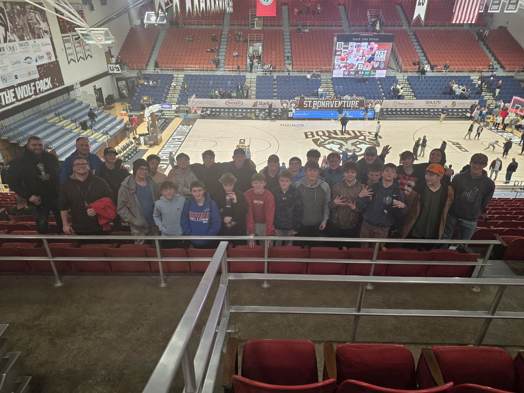 Group photo of boys basketball in the St. Bonaventure Gym