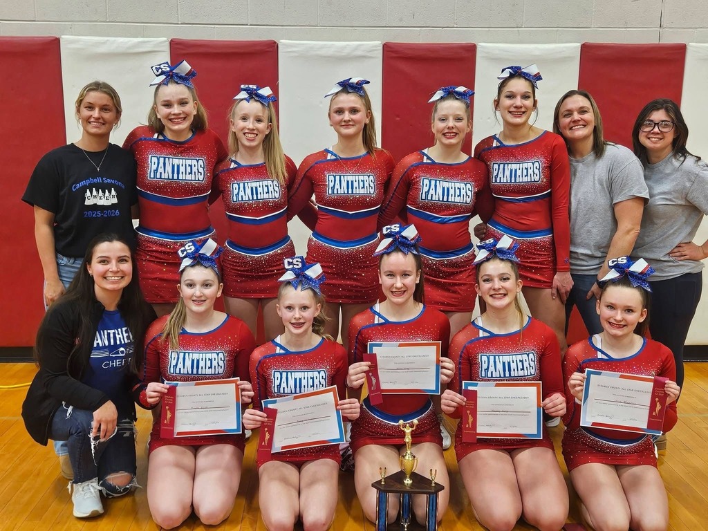Group photo of cheer team with front row all stars holding certificates