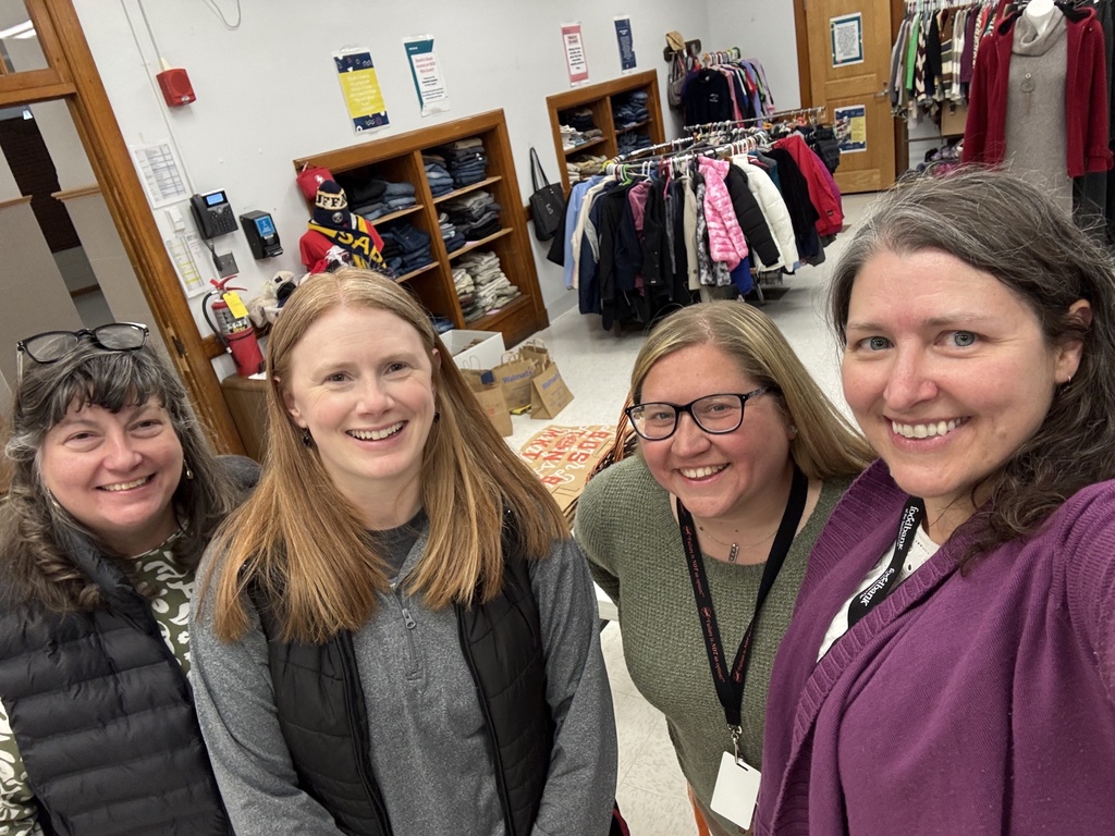 4 teacher smilng for picture in Rachel's closet