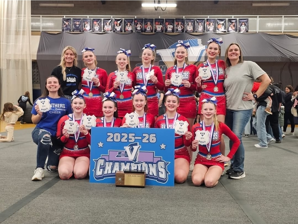 CS Cheer team posing iwth sectional trophy and bannner