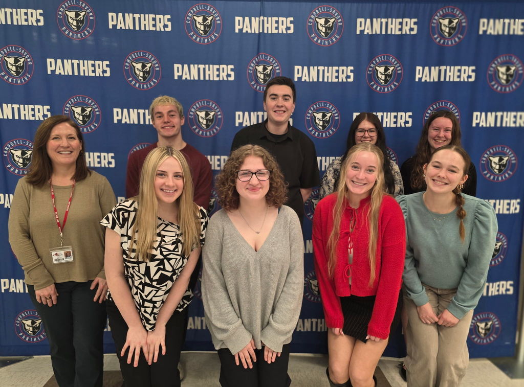 Group photo oif students in front of Panthers backdrop