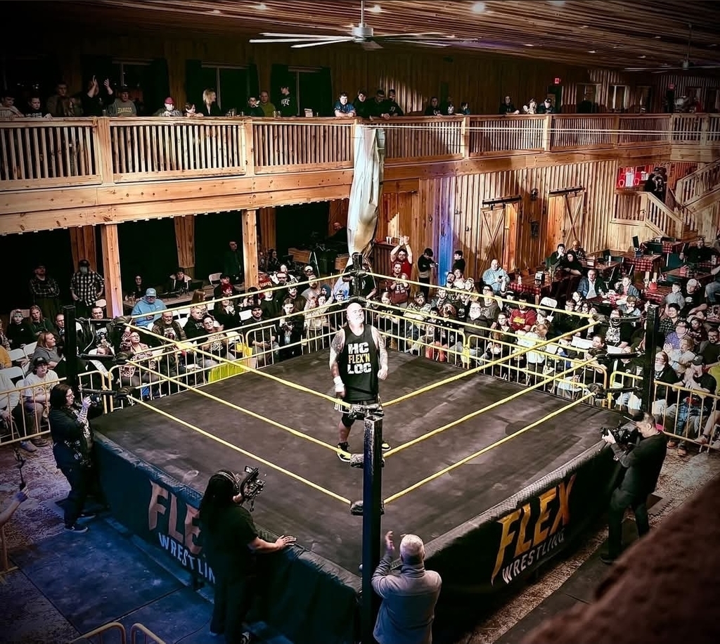 Wrestler standing in the middle of a ring