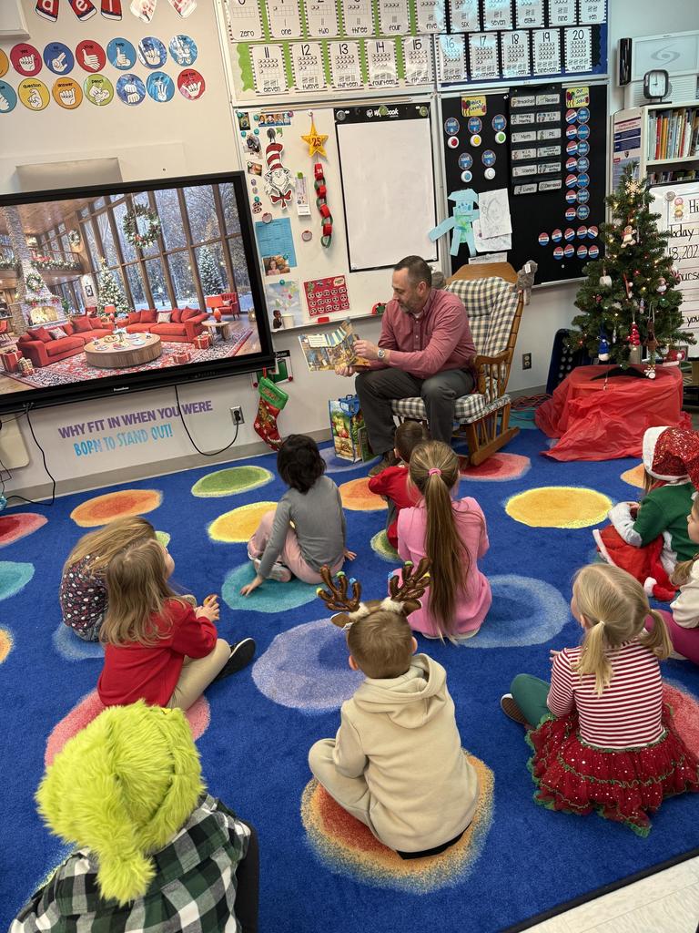 Supt reading books to elementary students