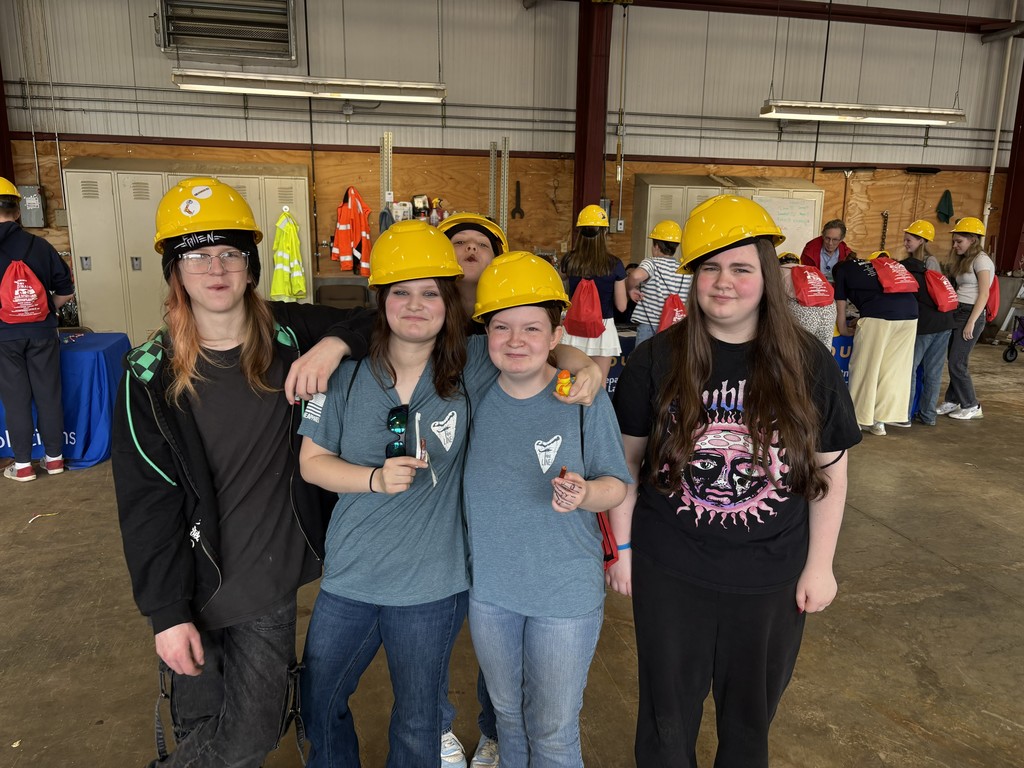 STudents posing in hard hats