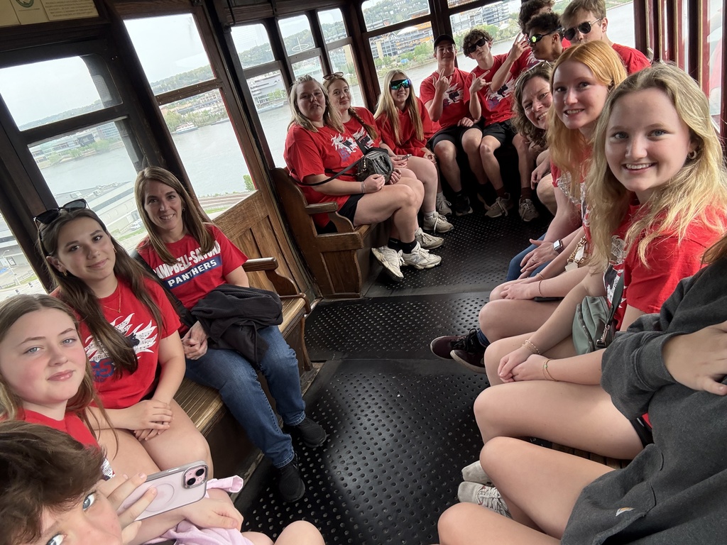 Students posing for picture in red shirts