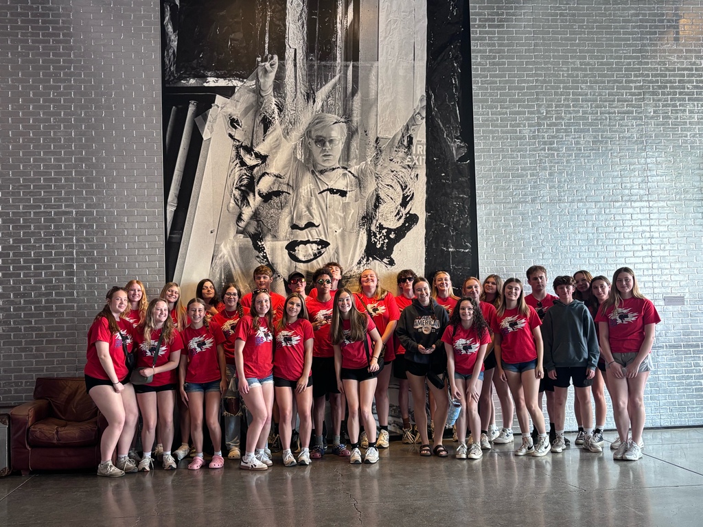 Band grroup photo in red shirts