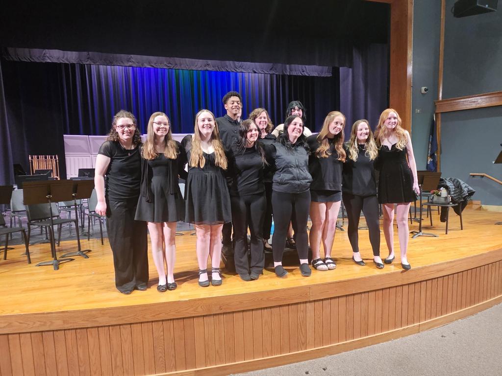HS School band seniors on stage wearing black