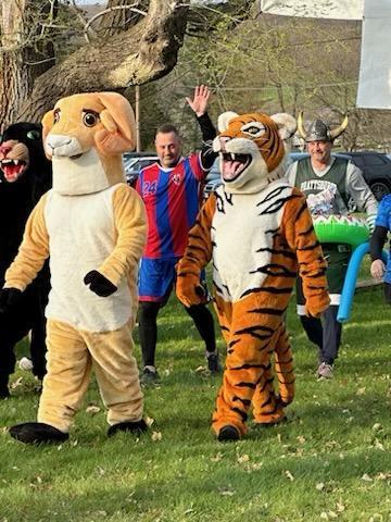 School mascots walking on grass