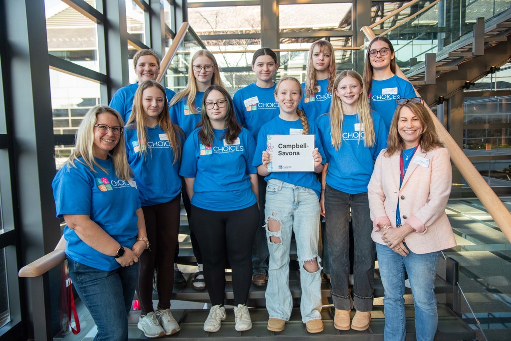 Group photo of students in Blue "Choices" shirt