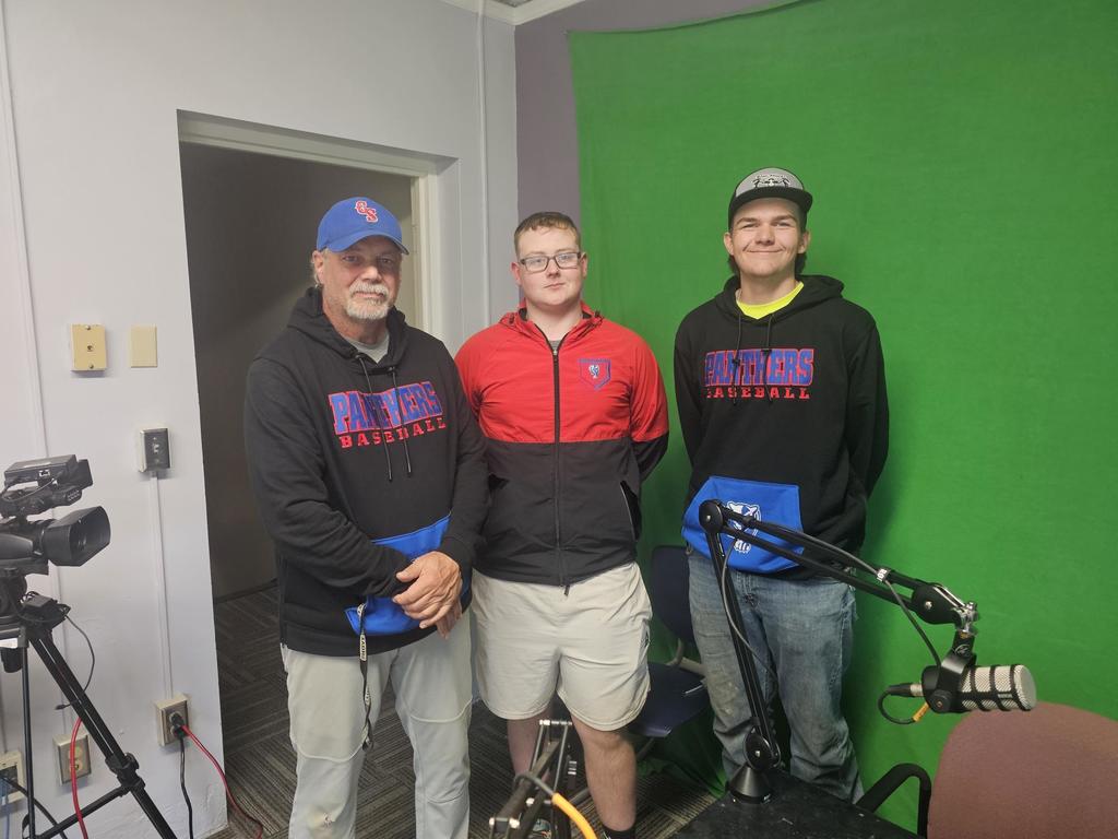 Picture of baseball coach and two players
