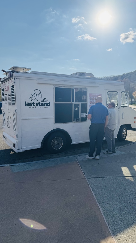 Two teahcers ordering from iuce cream truck