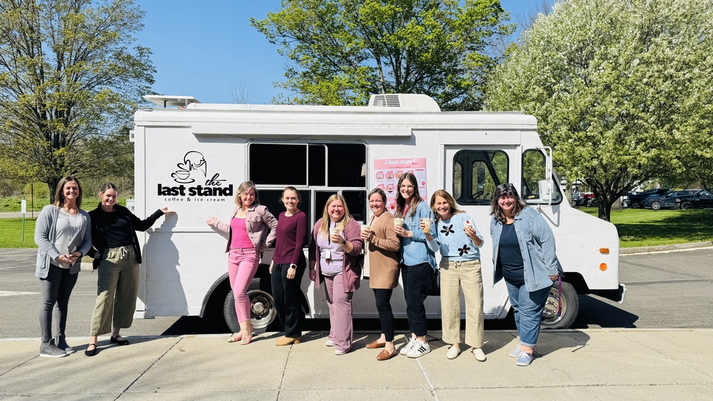 Group photo of teachers standing in front of last stand ice cream truck