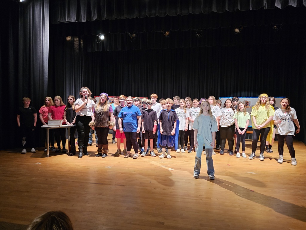 Full cast on stage for the 6th grade play