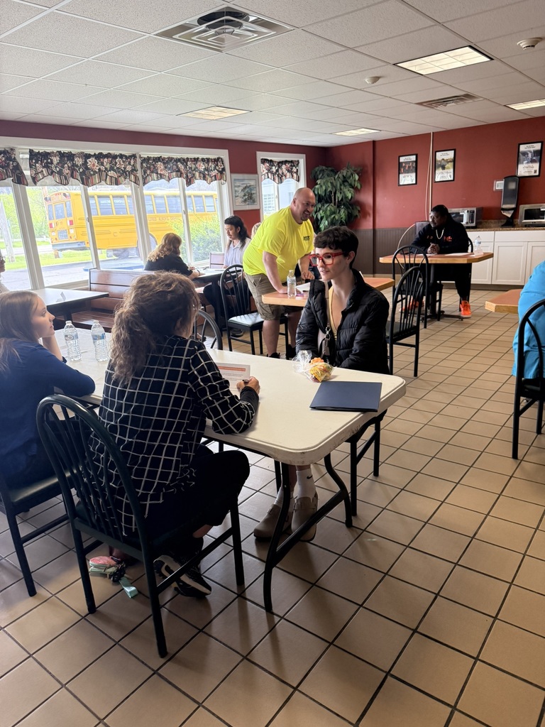 Student sitting in interview at table