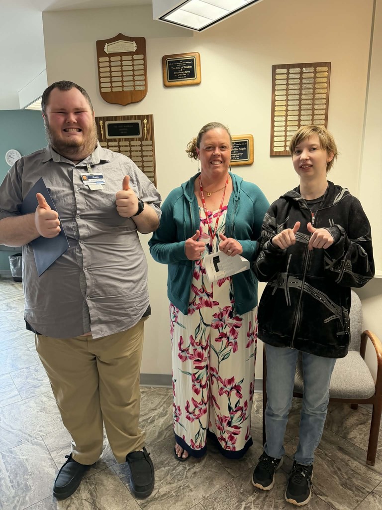 3 people standing with thumbs up for picture