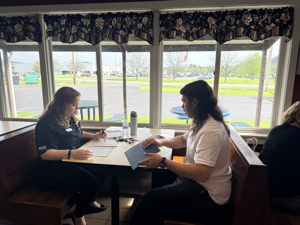 Student sitting in interview at table