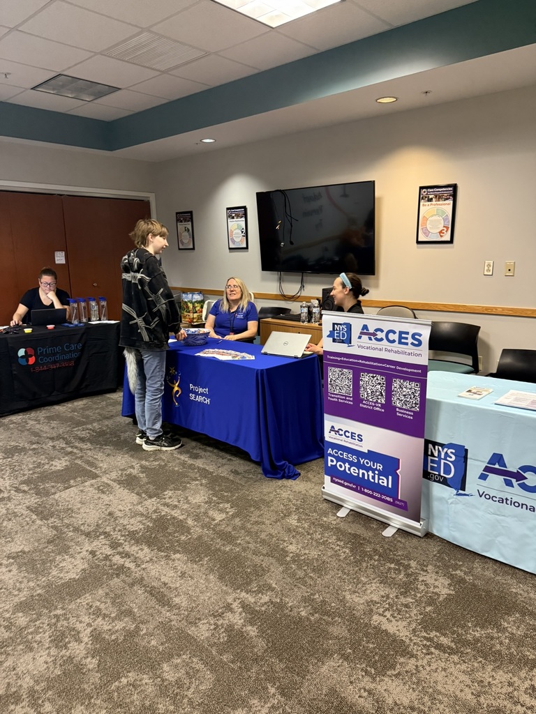 Student talking to information booth operator