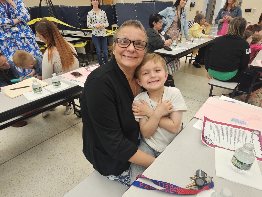 Mom and child sitting on lap smilng