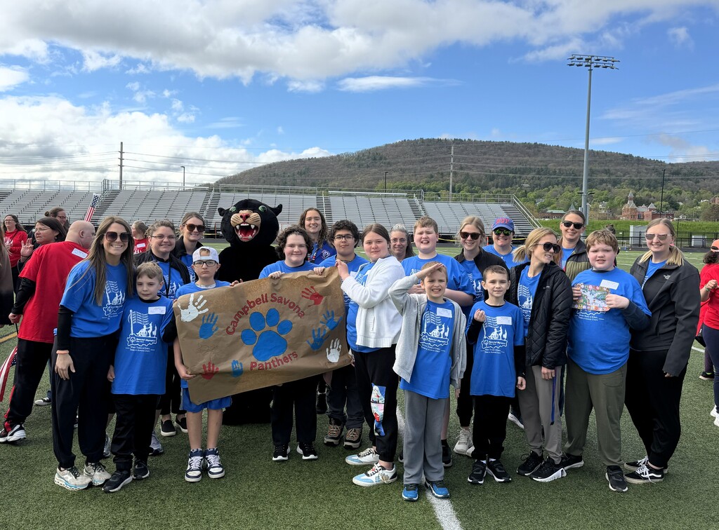 Group picture of students in blue shirts at the special olympics
