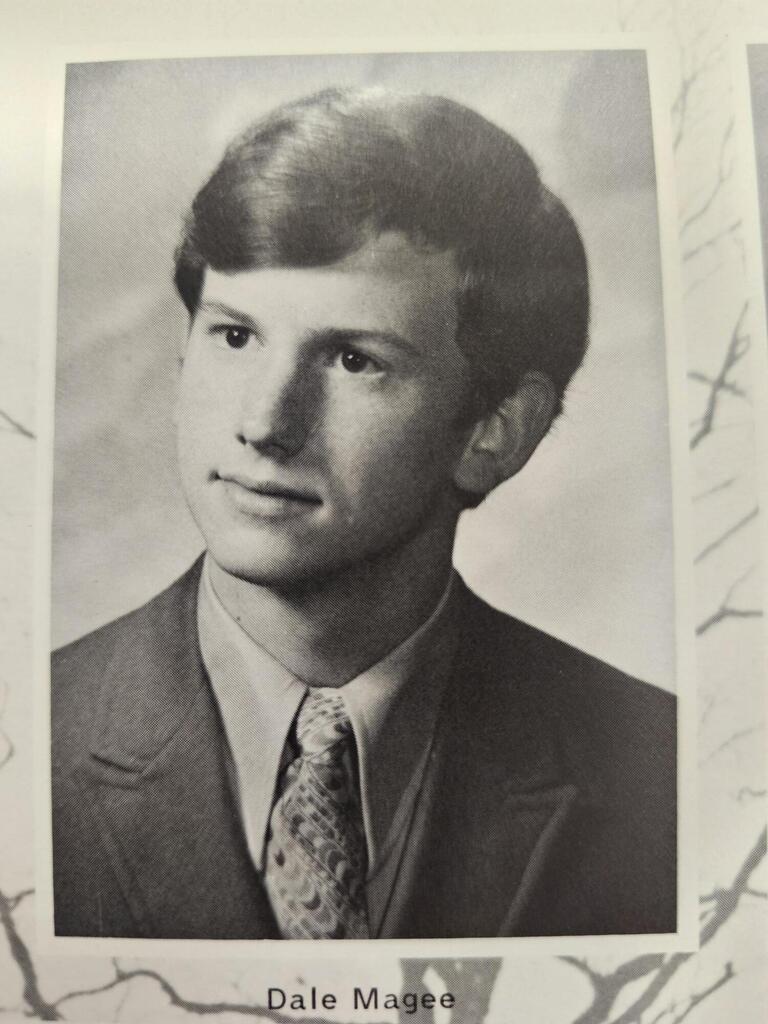 Black and white yearbook photo of man in suit