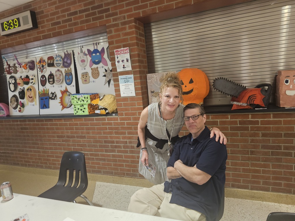 Two art teachers posing for picture.