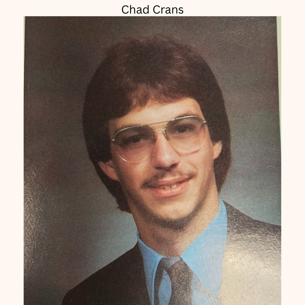 Class picture of senior witth glassed shirt and tie