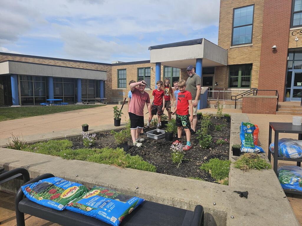 Students posing for picture in garden