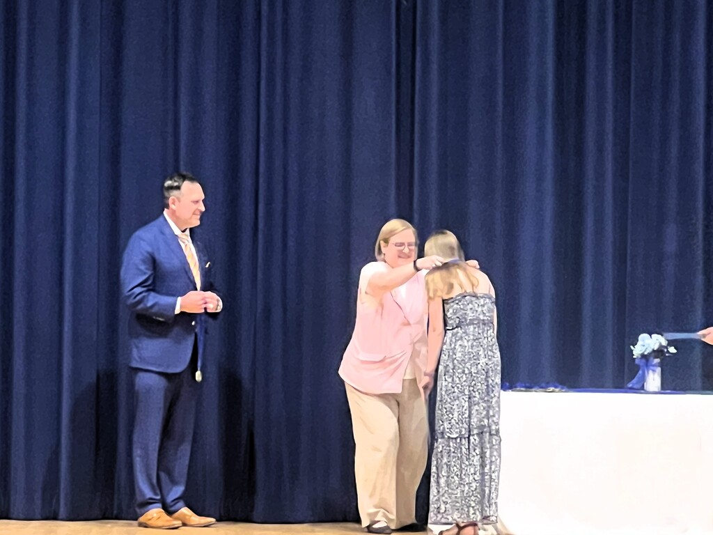 STudent recieving award on stage