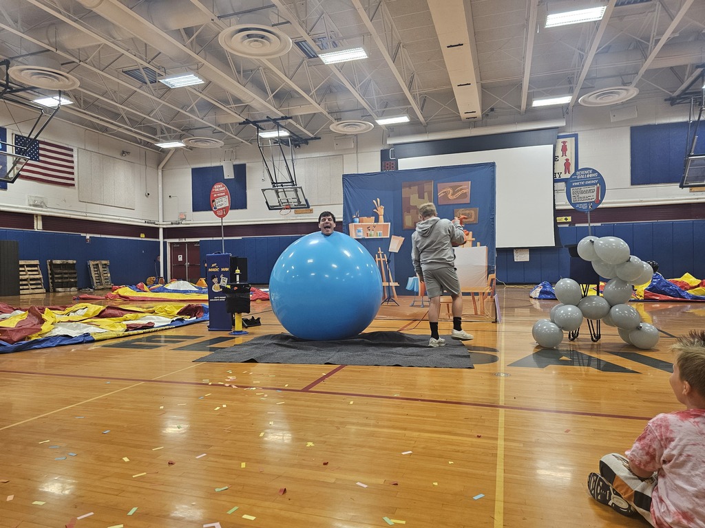 Adult in a big blue balloon