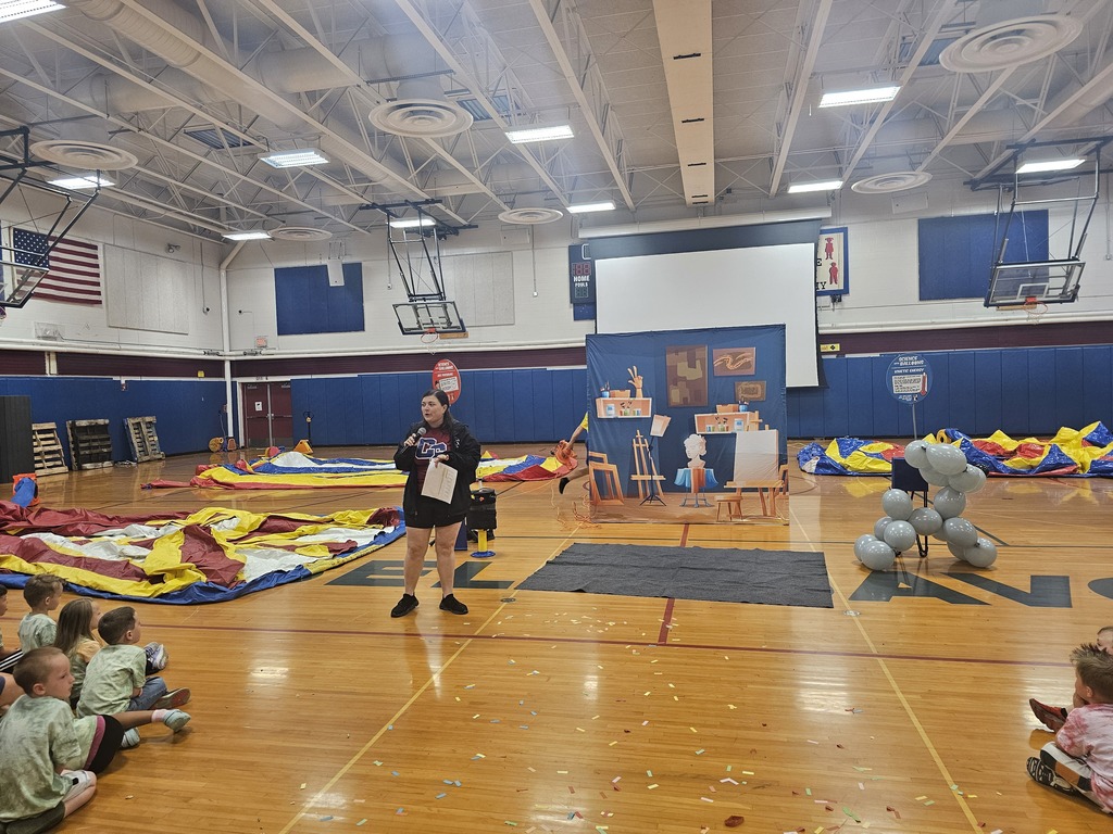 Teacher in gym talking on microphone