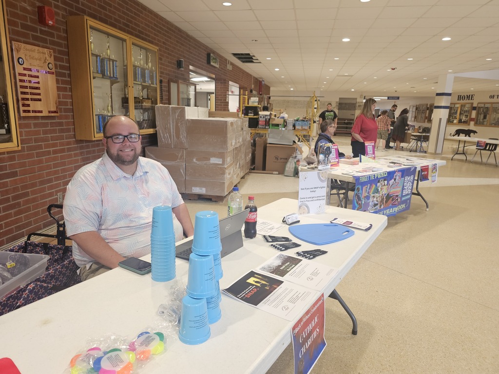 Man sitting at informational table
