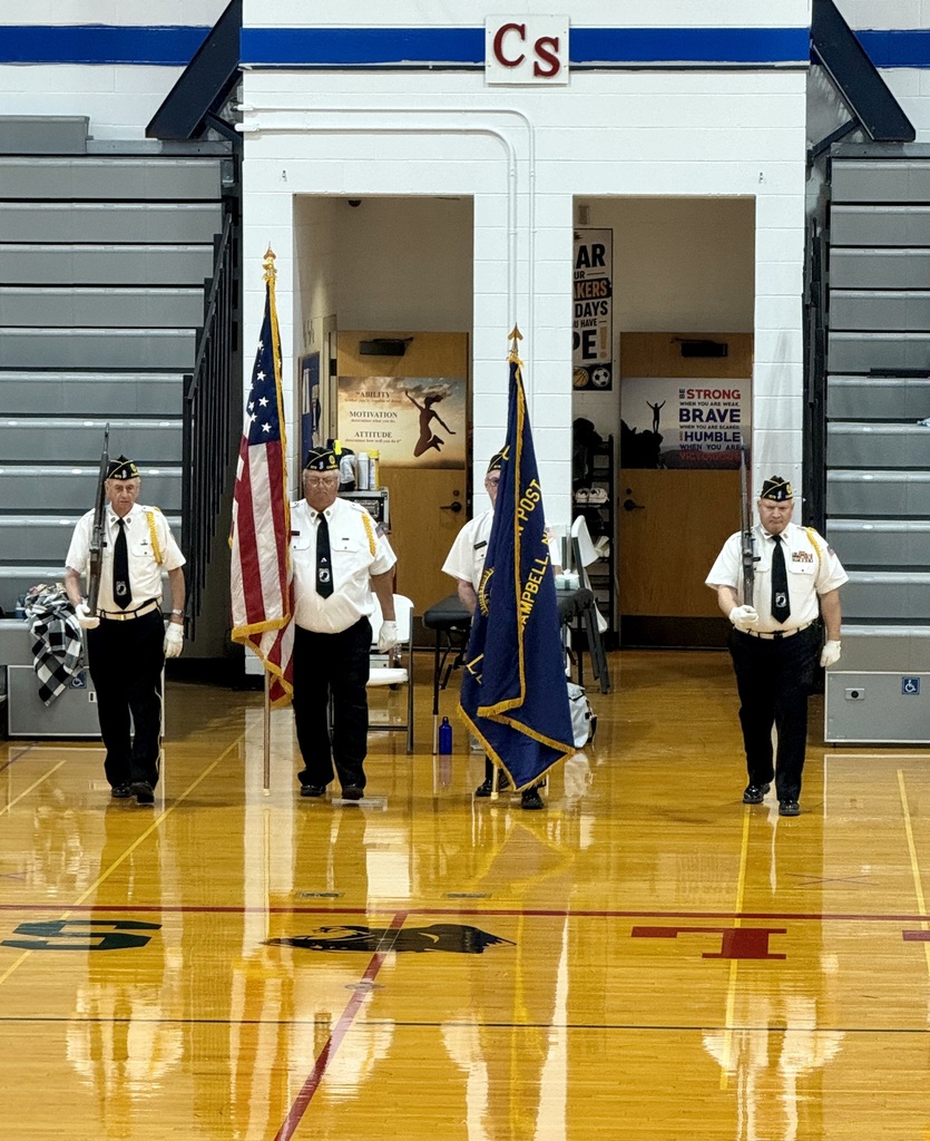 4 members of honor guard with flags